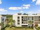 Condo building exterior showcasing balconies and landscaping at 50 Coe Rd # 331, Belleair, FL 33756