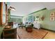 Bright living room features a comfy seating area with large windows offering abundant natural light at 50 Coe Rd # 331, Belleair, FL 33756