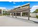 Relaxing community patio with pergola and seating area at 50 Coe Rd # 331, Belleair, FL 33756