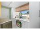 Vanity with mirror in a well-lit dressing room at 50 Coe Rd # 331, Belleair, FL 33756