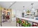 Modern white kitchen with ample storage and yellow backsplash at 50 Coe Rd # 331, Belleair, FL 33756