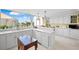 Modern white kitchen with large windows and water views at 50 Coe Rd # 331, Belleair, FL 33756