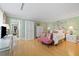 Serene bedroom with a white wardrobe and floral bedding, complemented by green walls at 50 Coe Rd # 331, Belleair, FL 33756