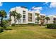 Modern condo building with private balconies and lush landscaping at 50 Coe Rd # 331, Belleair, FL 33756