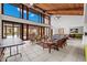 Bright and airy community room with wicker furniture and pool view at 50 Coe Rd # 331, Belleair, FL 33756