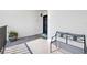 Private condo entry with a bench and potted plant at 50 Coe Rd # 331, Belleair, FL 33756