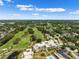 Aerial view showing condo community and lush green golf course at 50 Coe Rd # 331, Belleair, FL 33756