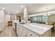 Kitchen features white cabinets, stainless steel appliances and large island at 36750 Us Highway 19 N # 20-213, Palm Harbor, FL 34684