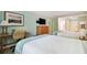 Bedroom with two beds, desk, and dresser at 36750 Us Highway 19 N # 20-213, Palm Harbor, FL 34684