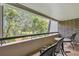 Private balcony with scenic treetop views at 36750 Us Highway 19 N # 20-213, Palm Harbor, FL 34684