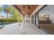 Open patio with wooden ceilings with stainless steel outdoor kitchen, overlooking the pool and the interior kitchen at 2519 N Riverside Dr, Tampa, FL 33602