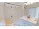 Bathroom featuring a tub-shower combination, single sink vanity with towels, and a lighted mirror at 679 Lake Maggiore S Blvd, St Petersburg, FL 33705