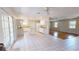 Kitchen with tile floor and island looking towards living room with hardwood floors at 679 Lake Maggiore S Blvd, St Petersburg, FL 33705