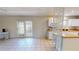 Open-concept living and dining area with tile flooring and natural light through french doors at 679 Lake Maggiore S Blvd, St Petersburg, FL 33705