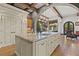 Large kitchen island with granite countertops and double sinks, opens to Gathering room at 7725 Still Lakes Dr, Odessa, FL 33556