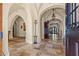 Grand entry with high ceilings, arched doorways and elegant tile flooring at 7725 Still Lakes Dr, Odessa, FL 33556