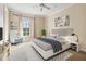 Bedroom with a large bed and a comfortable armchair at 7725 Still Lakes Dr, Odessa, FL 33556
