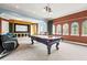 Entertain in style with a pool table, home theater, and comfortable seating at 7725 Still Lakes Dr, Odessa, FL 33556