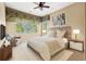 Relaxing bedroom with sitting area and plenty of natural light at 7725 Still Lakes Dr, Odessa, FL 33556