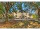 Stunning two story home with manicured lawn and mature trees at 7725 Still Lakes Dr, Odessa, FL 33556