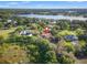 Luxury estate home situated on waterfront property with lush landscaping at 7725 Still Lakes Dr, Odessa, FL 33556