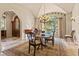 Formal dining room with large windows and a beautiful chandelier at 7725 Still Lakes Dr, Odessa, FL 33556