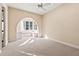 Bright bedroom featuring an arched window seat and ample floor space at 7725 Still Lakes Dr, Odessa, FL 33556