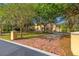 Elegant home exterior with a brick driveway and manicured lawn at 7725 Still Lakes Dr, Odessa, FL 33556