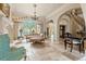 Spacious great room with fireplace, large windows and ample seating at 7725 Still Lakes Dr, Odessa, FL 33556