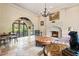 Cozy sitting room with fireplace, large windows and comfortable furniture at 7725 Still Lakes Dr, Odessa, FL 33556