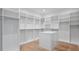 Large walk-in closet with ample shelving and hanging space at 2519 N Riverside Dr, Tampa, FL 33602