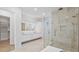 Modern bathroom with double vanity, large mirror, and walk-in shower at 2519 N Riverside Dr, Tampa, FL 33602