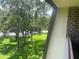 Scenic view from balcony overlooking trees and park-like setting at 36750 Us Highway 19 N # 15-310, Palm Harbor, FL 34684