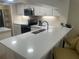 Modern kitchen with white cabinets and stainless steel appliances at 36750 Us Highway 19 N # 15-310, Palm Harbor, FL 34684