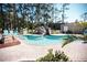 Small community spa with waterfall feature and seating area at 36750 Us Highway 19 N # 15-310, Palm Harbor, FL 34684