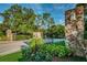 Stone pillars and wrought iron gates mark entrance to community at 36750 Us Highway 19 N # 15-310, Palm Harbor, FL 34684
