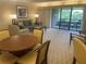 Spacious living area with access to a balcony and view at 36750 Us Highway 19 N # 15-310, Palm Harbor, FL 34684