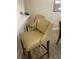 Two beige leather barstools at the kitchen counter at 36750 Us Highway 19 N # 15-310, Palm Harbor, FL 34684
