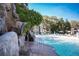 Waterfall feature cascading into a refreshing pool at 36750 Us Highway 19 N # 15-310, Palm Harbor, FL 34684