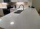 Modern kitchen with white cabinets and quartz countertops at 36750 Us Highway 19 N # 15-310, Palm Harbor, FL 34684
