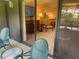 Balcony with patio furniture offering a view of the kitchen at 36750 Us Highway 19 N # 15-310, Palm Harbor, FL 34684