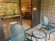 Private balcony with patio furniture and view of living room at 36750 Us Highway 19 N # 15-310, Palm Harbor, FL 34684