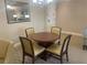 Round dining table with four chairs in a well lit space at 36750 Us Highway 19 N # 15-310, Palm Harbor, FL 34684