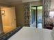 Main bedroom with access to balcony and ensuite bathroom at 36750 Us Highway 19 N # 15-310, Palm Harbor, FL 34684