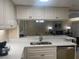 Modern kitchen with white cabinets and quartz countertops at 36750 Us Highway 19 N # 15-310, Palm Harbor, FL 34684
