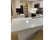 Modern kitchen with white cabinets, stainless steel appliances, and a breakfast bar at 36750 Us Highway 19 N # 15-310, Palm Harbor, FL 34684