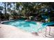 Inviting community pool with a waterslide and brick patio at 36750 Us Highway 19 N # 15-310, Palm Harbor, FL 34684