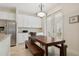Bright kitchen with white cabinets, granite counters, and breakfast nook at 6319 Vista Verde E Dr, Gulfport, FL 33707