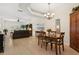 Dining room adjacent to living room with hardwood floors at 6319 Vista Verde E Dr, Gulfport, FL 33707