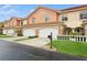 Attractive townhome with a two-car garage and lush landscaping at 6319 Vista Verde E Dr, Gulfport, FL 33707